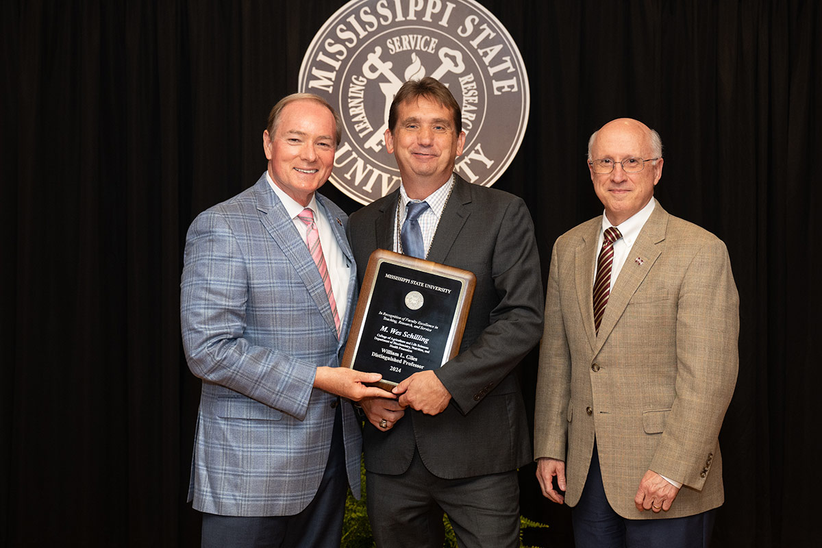 MSU President Mark E. Keenum, left, poses with this year’s Giles Distinguished Professor Wes Schilling, center, and MSU Provost 