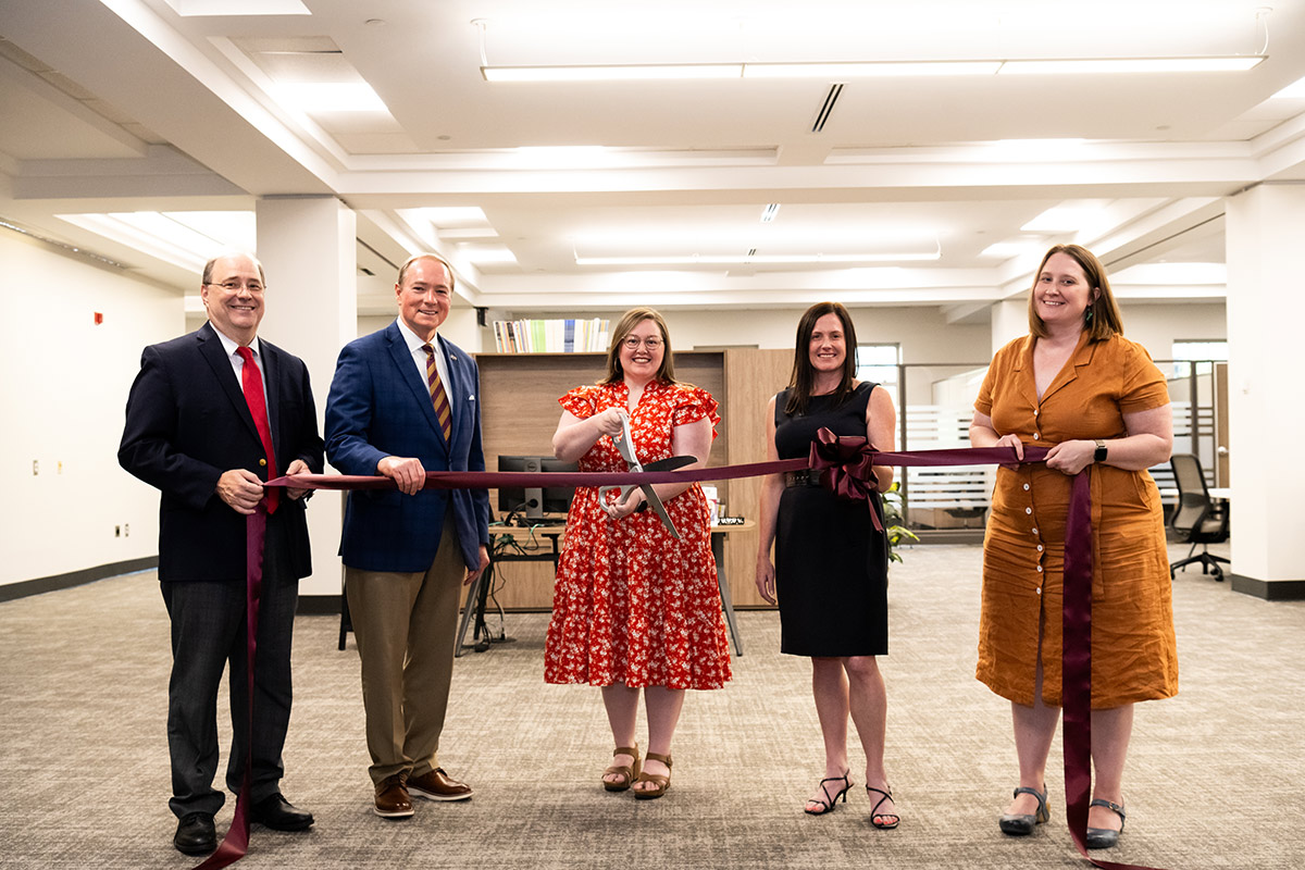 MSU leaders celebrated the ribbon cutting for the university's Writing Center, relocated in August